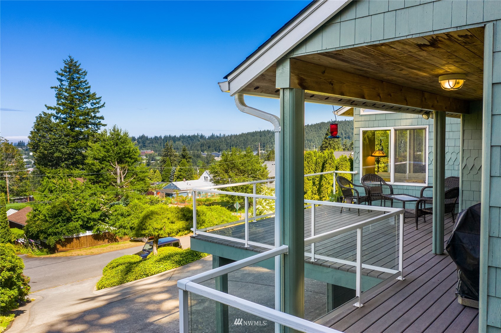 1415 37th Street Bellingham, WA 98229 - Photo 33 of 37 a view of a balcony with chairs and wooden floor
