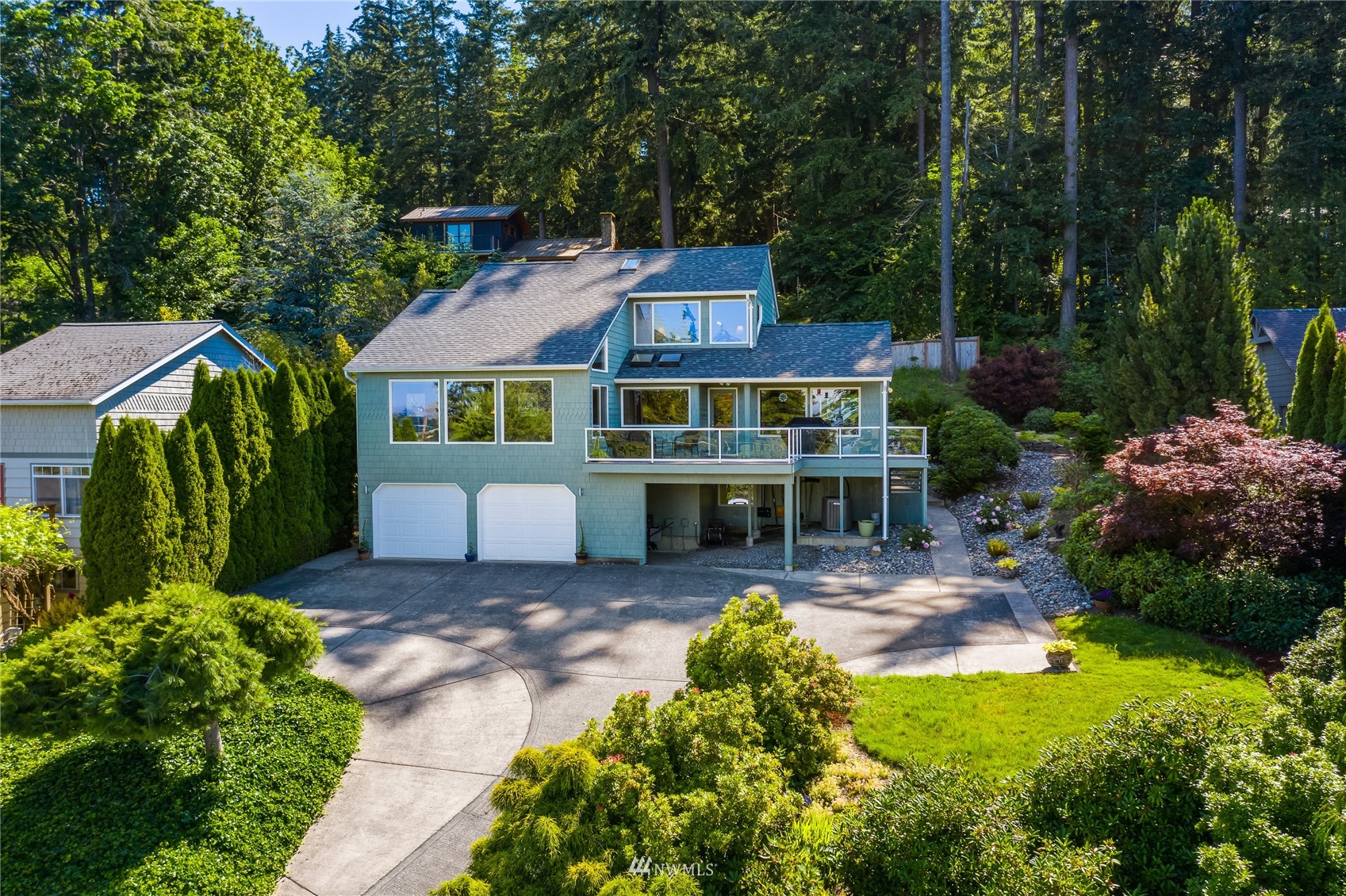 1415 37th Street Bellingham, WA 98229 - Photo 36 of 37 a view of a house with a small yard plants and large tree