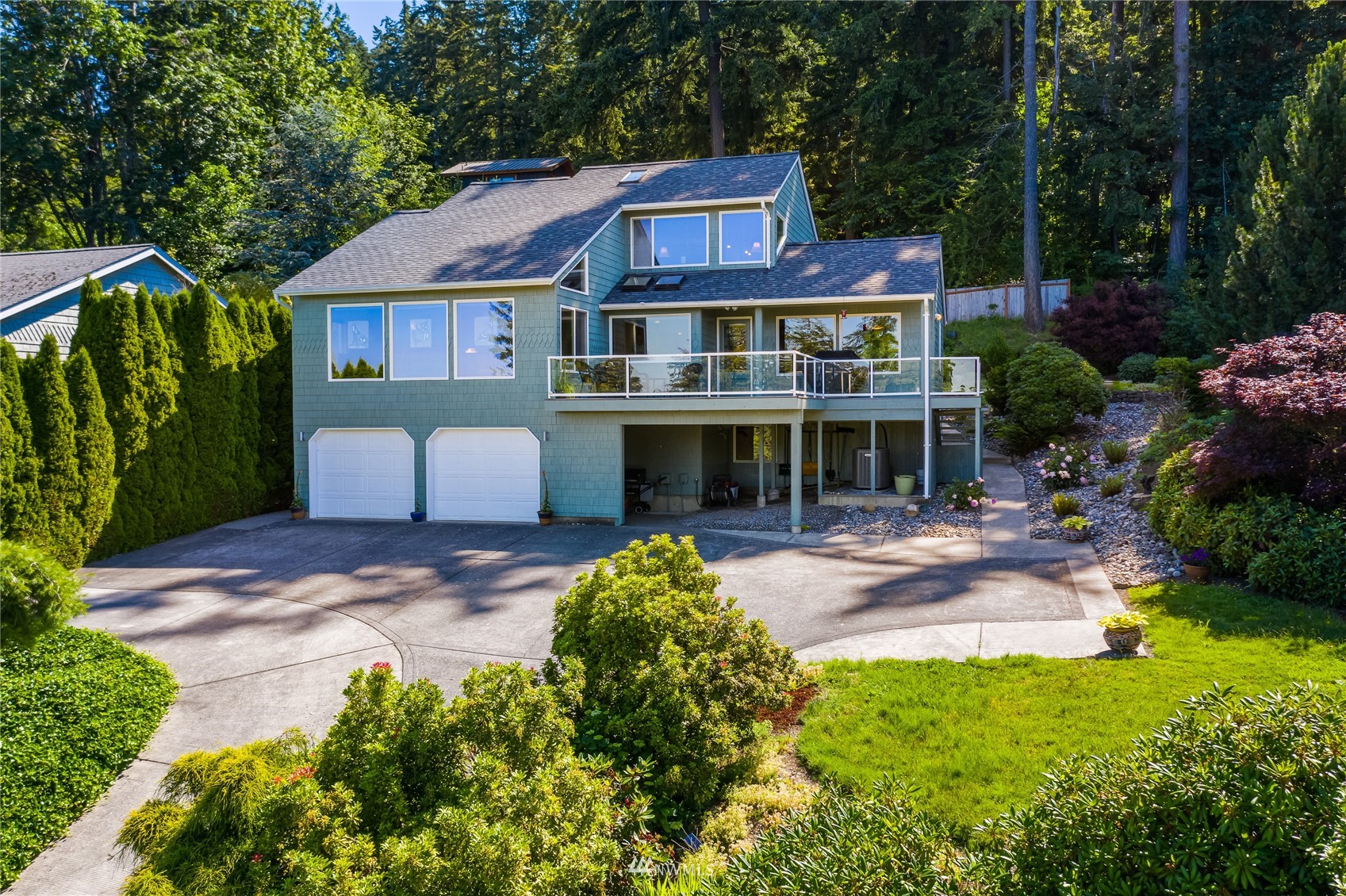 1415 37th Street Bellingham, WA 98229 - Photo 37 of 37 a front view of a house with a yard and porch