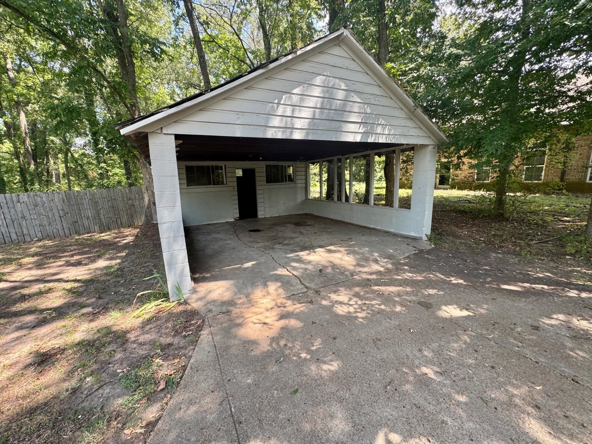 4564 Stage Road Memphis, TN 38128 - Photo 15 of 15 Garage featuring concrete driveway