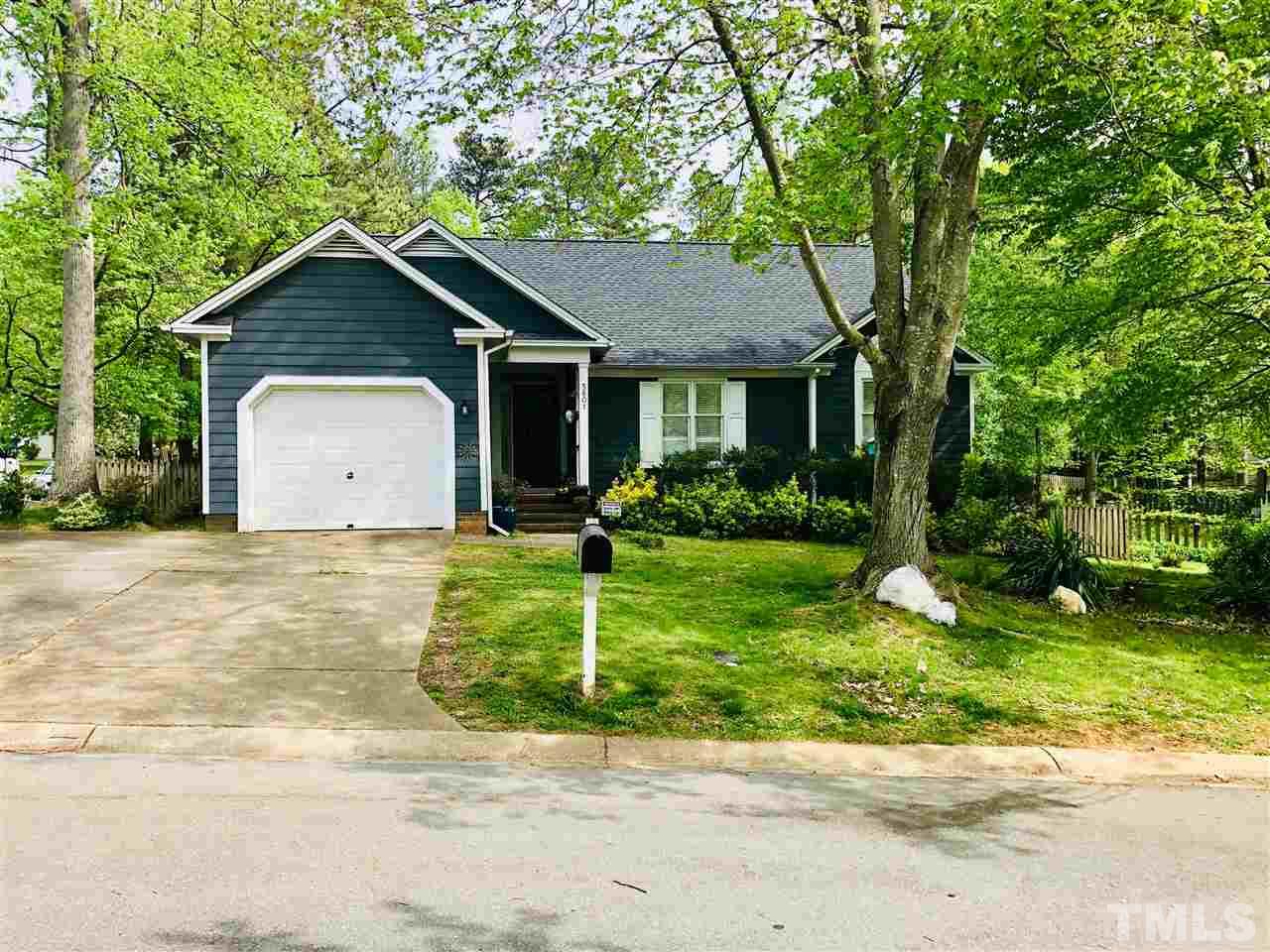 5601 Edgebury Road Raleigh, NC 27613 - Photo 1 of 12 a view of a house with a yard plants and large tree