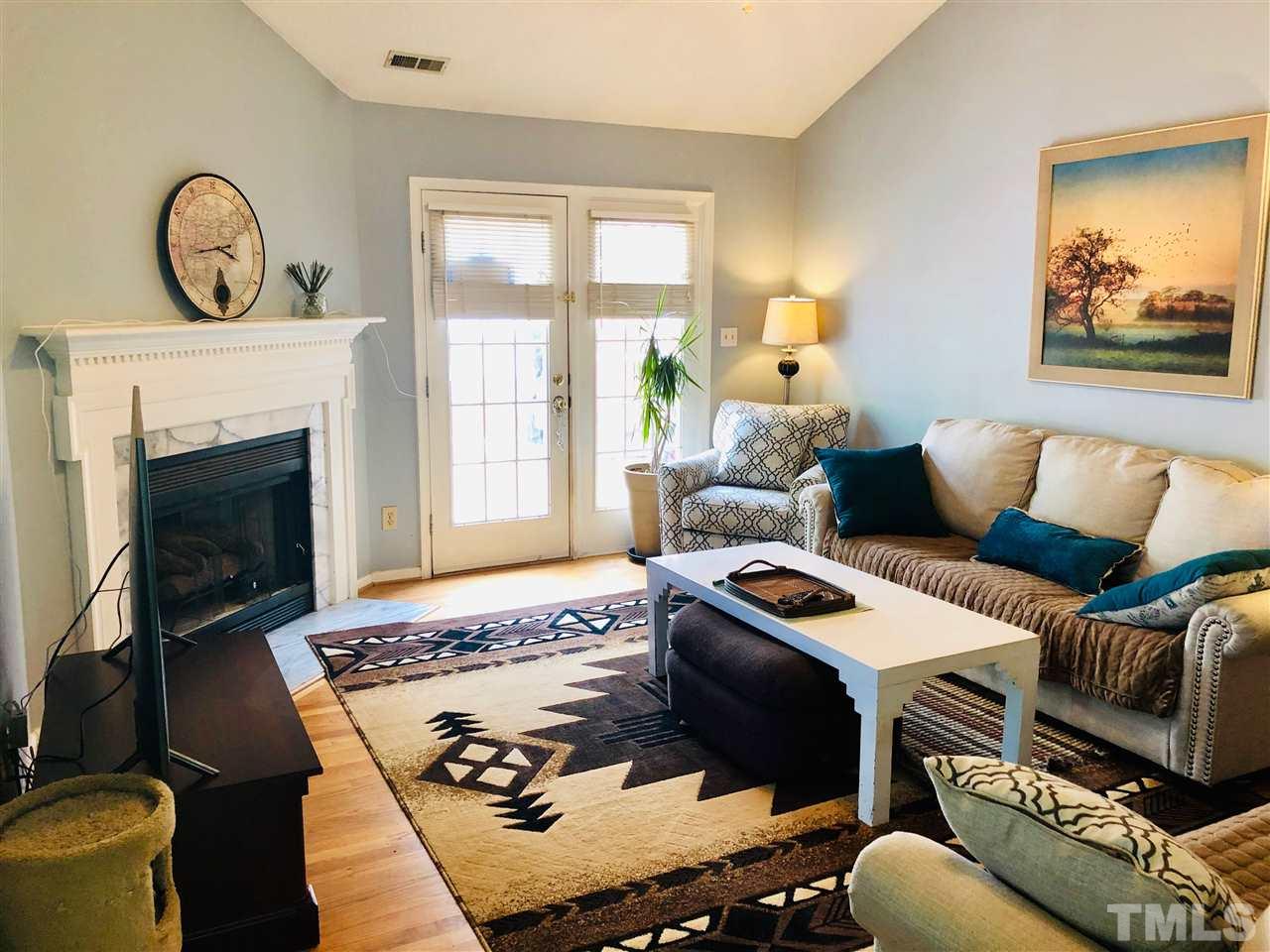 5601 Edgebury Road Raleigh, NC 27613 - Photo 2 of 12 a living room with furniture and a fireplace