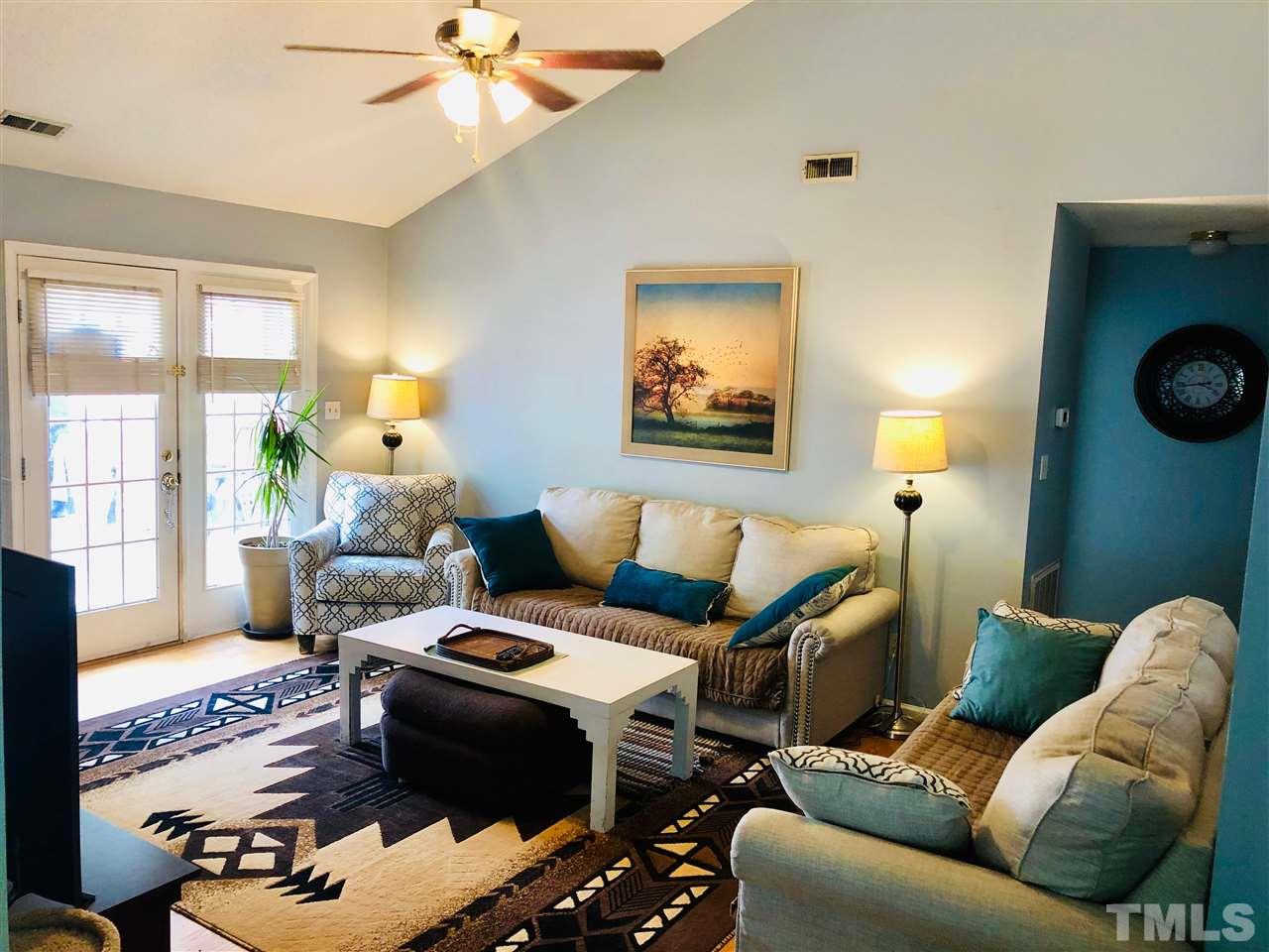 5601 Edgebury Road Raleigh, NC 27613 - Photo 3 of 12 a living room with furniture and a large window