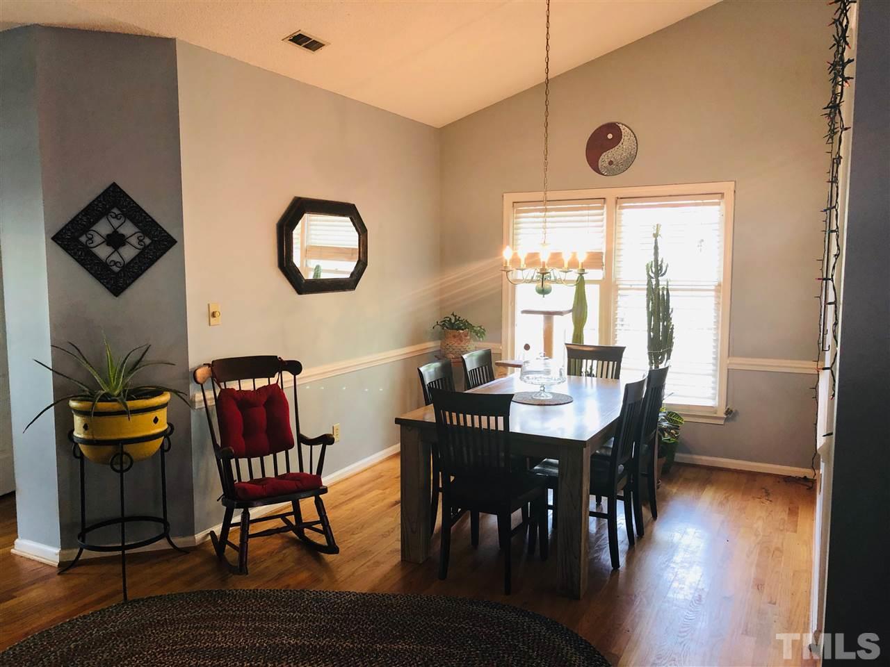 5601 Edgebury Road Raleigh, NC 27613 - Photo 6 of 12 a view of a dining room with furniture and wooden floor