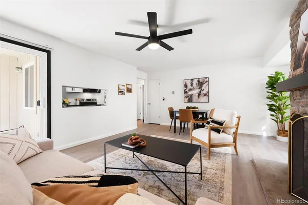 a dining room with furniture and wooden floor