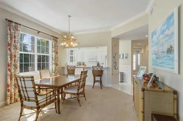 a view of a dining room with furniture and window