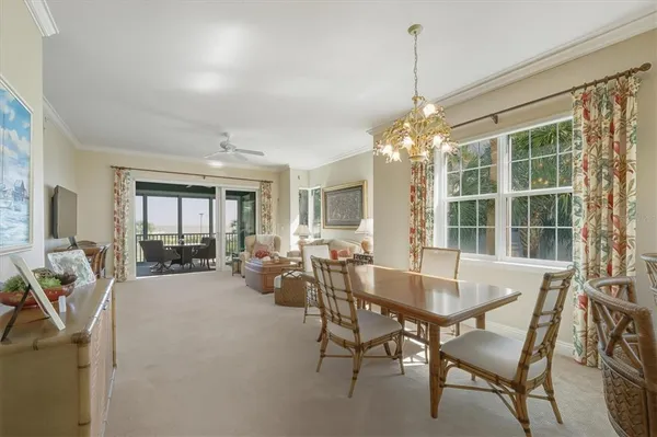 a view of a dining room with furniture window and outside view