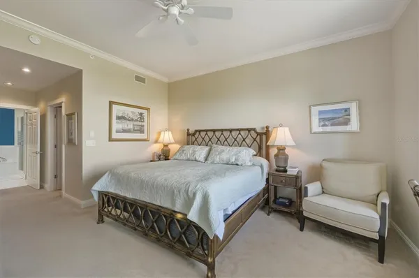 a bedroom with a bed and a couch