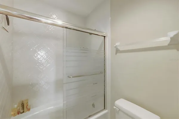 a view of a hallway with washer and dryer