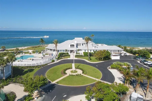 an aerial view of a residential houses with outdoor space