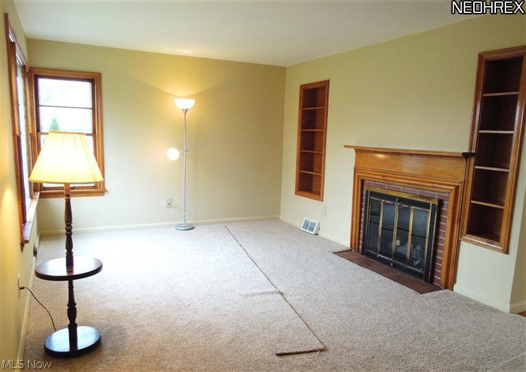 4575 Center Road Brunswick, OH 44212 - Photo 9 of 15 Charming built-ins surround a working wood burning fireplace!
