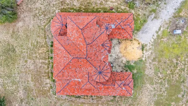 a view of a house with outdoor space and lake view