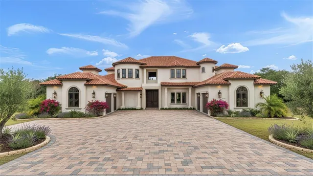 a view of white house with a yard