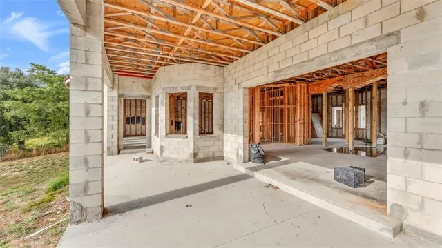 a view of entryway with wooden floor and windows