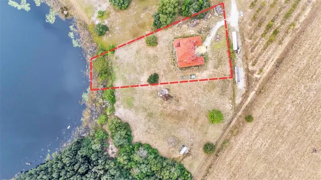 a view of spacious bedroom with a bed and glass window