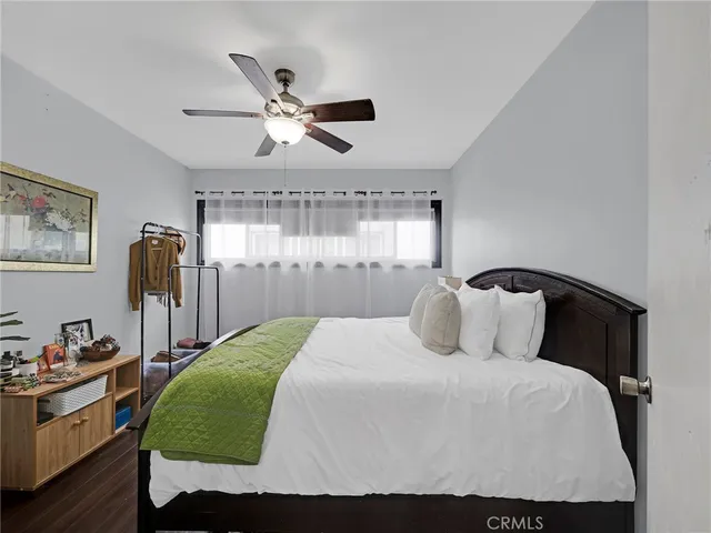 a bedroom with a bed and window