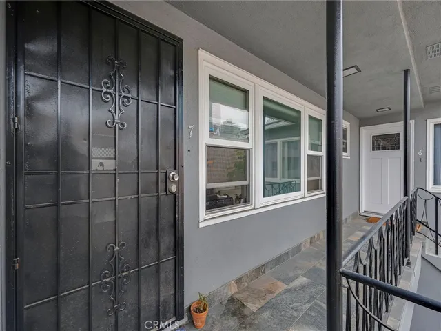 a view of a door and a window