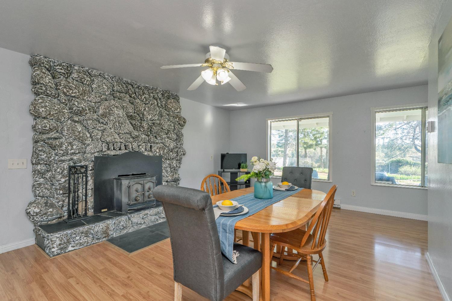 6261 Grizzly Flat Road Somerset, CA 95684 - Photo 11 of 63 a view of a dining room with furniture window and wooden floor