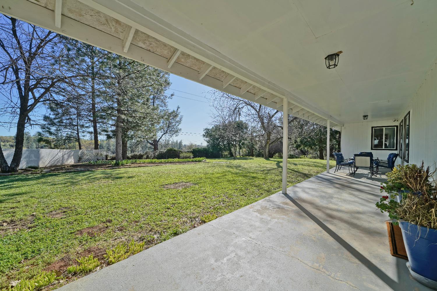 6261 Grizzly Flat Road Somerset, CA 95684 - Photo 14 of 63 a view of a house with backyard porch and sitting area