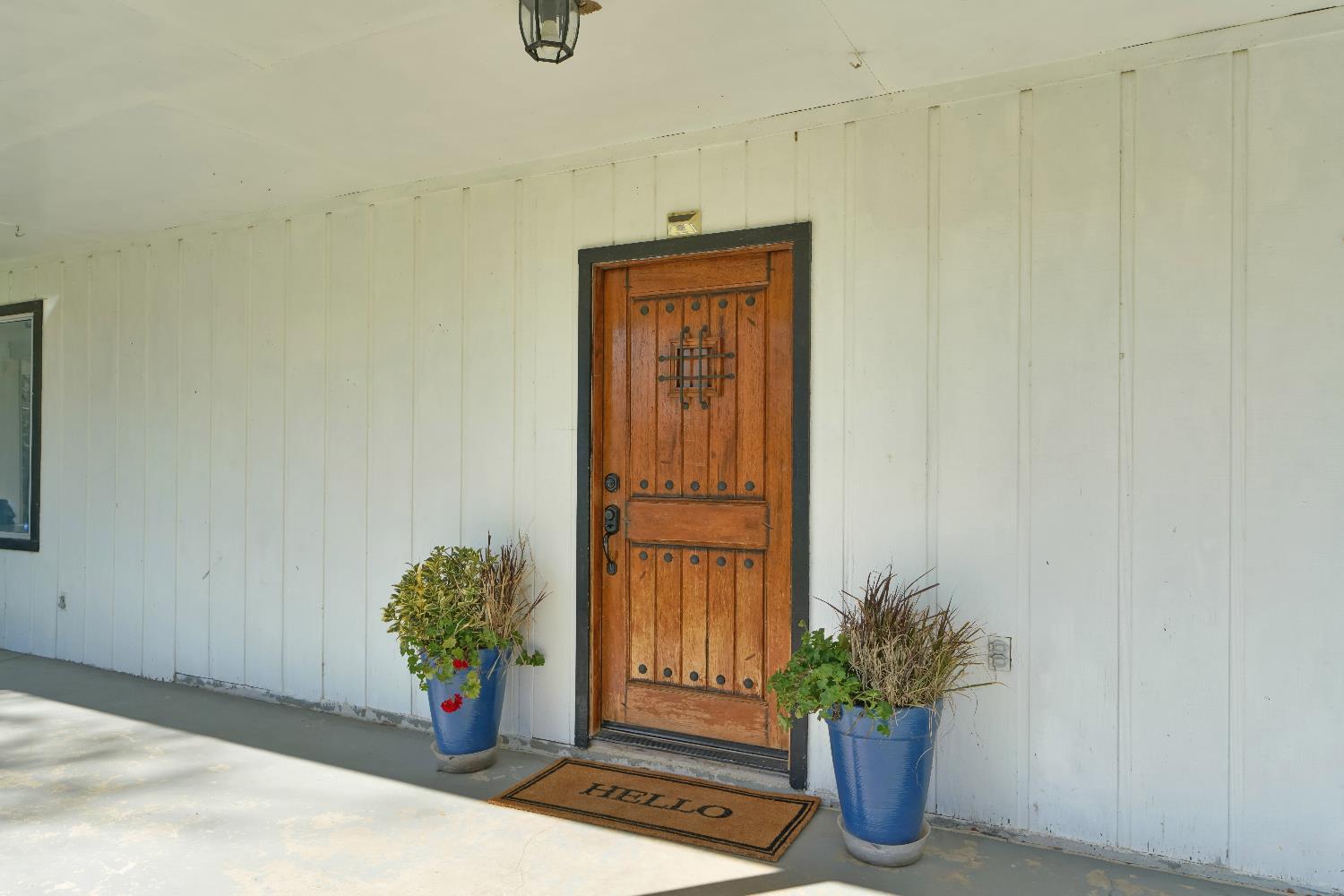 6261 Grizzly Flat Road Somerset, CA 95684 - Photo 18 of 63 a vase with flowers sitting on a floor