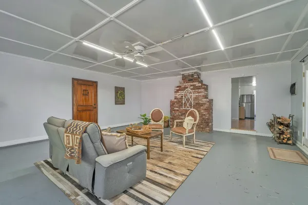 a living room with furniture and a fireplace