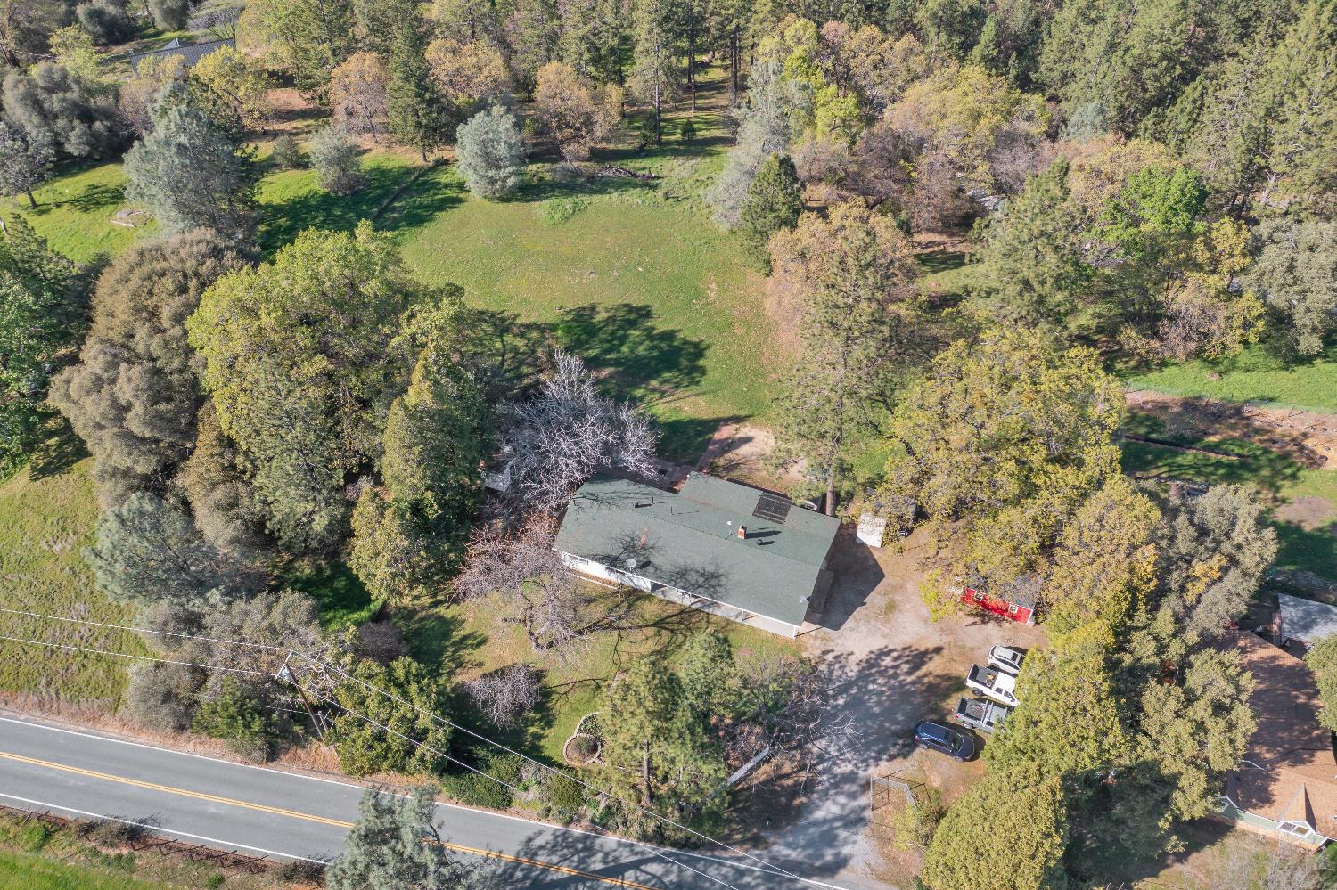 6261 Grizzly Flat Road Somerset, CA 95684 - Photo 2 of 63 a aerial view of a house with a yard and lake view
