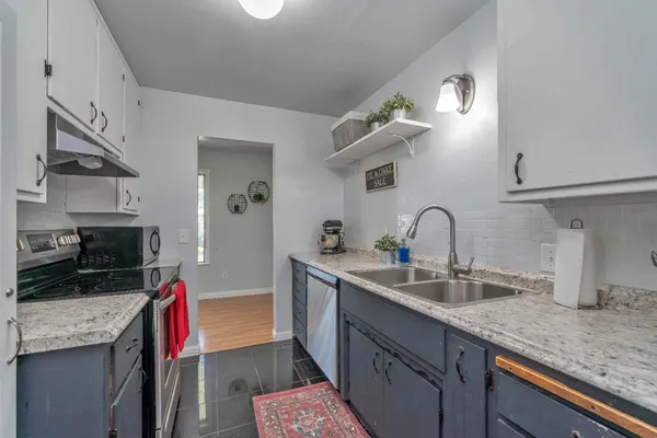 a bathroom with a sink vanity and a mirror