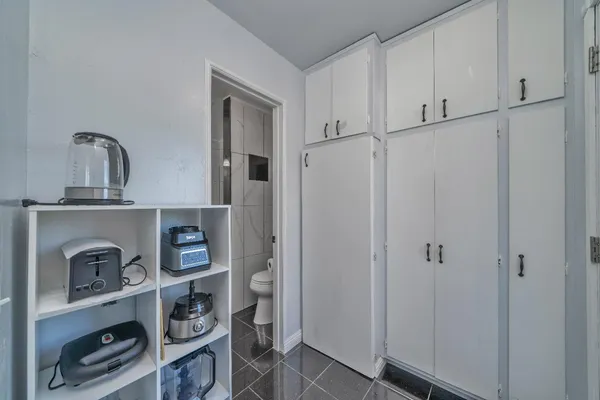 a bathroom with a shower and toilet
