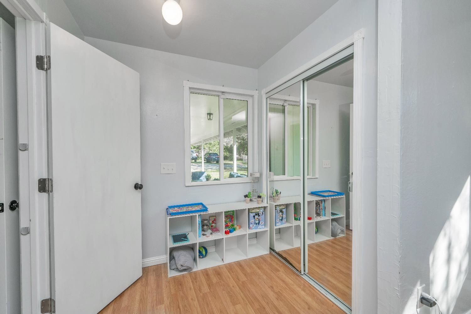 6261 Grizzly Flat Road Somerset, CA 95684 - Photo 39 of 63 a view of a hallway with wooden floor and dining room