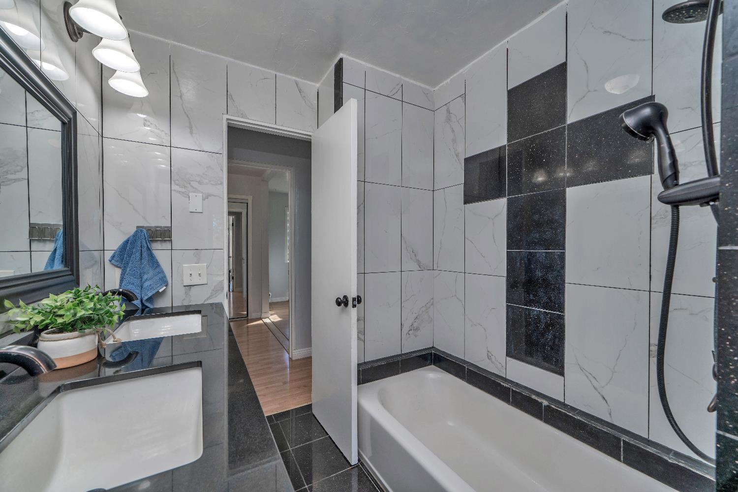 6261 Grizzly Flat Road Somerset, CA 95684 - Photo 41 of 63 a bathroom with a tub and shower