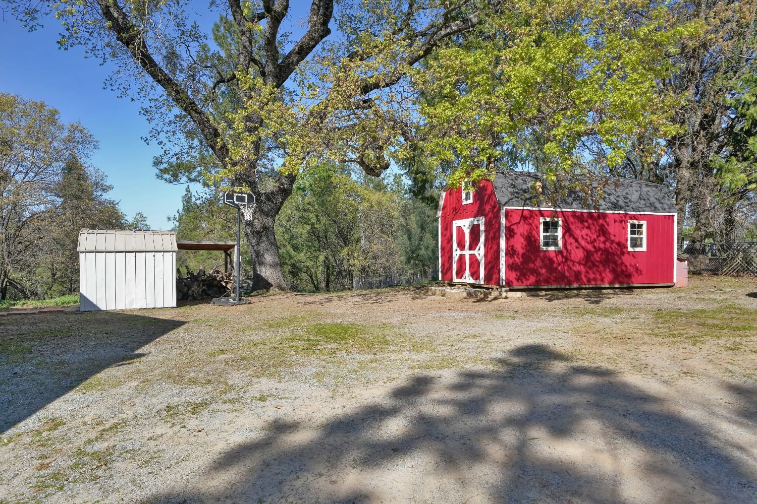 6261 Grizzly Flat Road Somerset, CA 95684 - Photo 46 of 63 a street sign that is sitting on a road