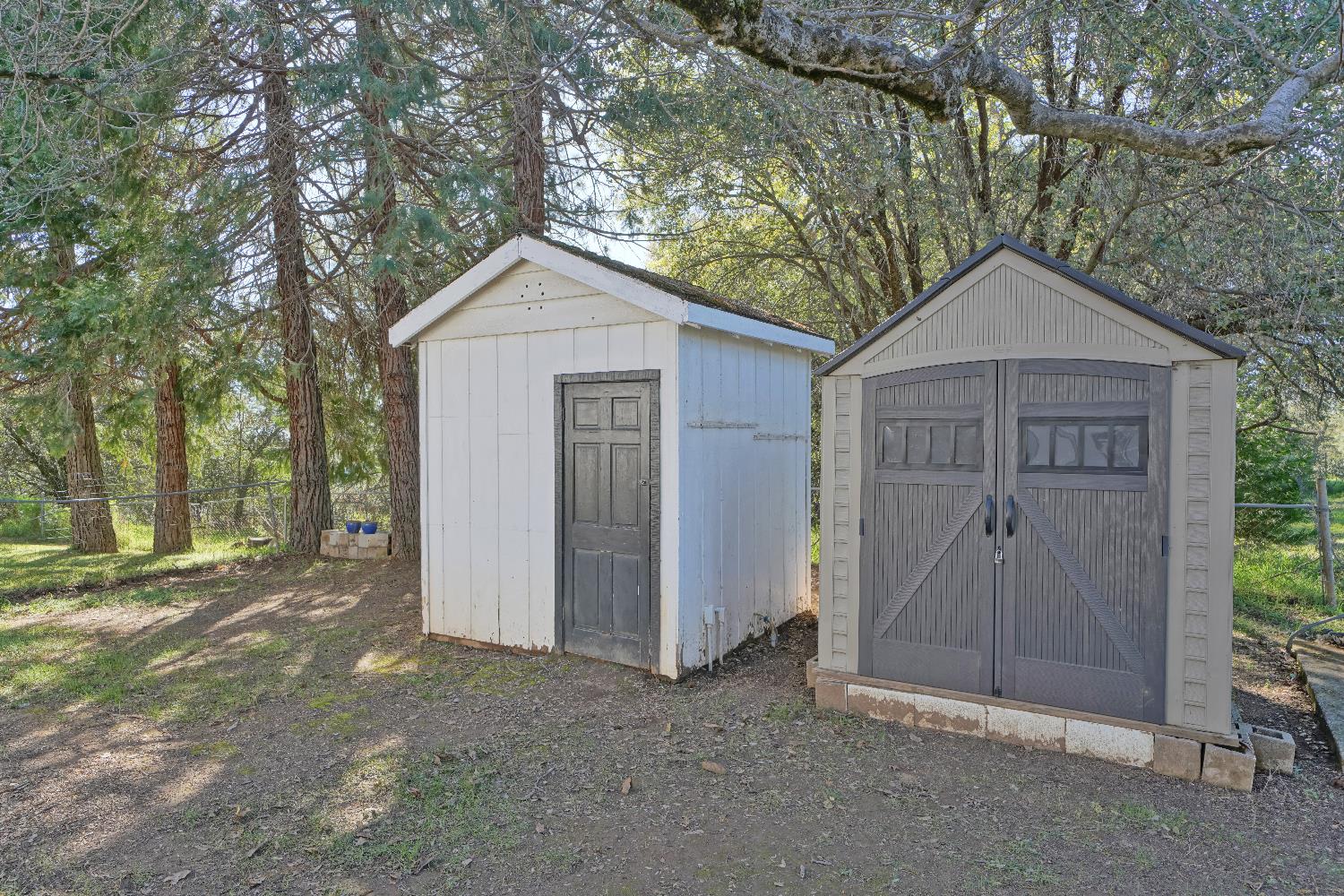 6261 Grizzly Flat Road Somerset, CA 95684 - Photo 52 of 63 a front view of a house with a yard and garage