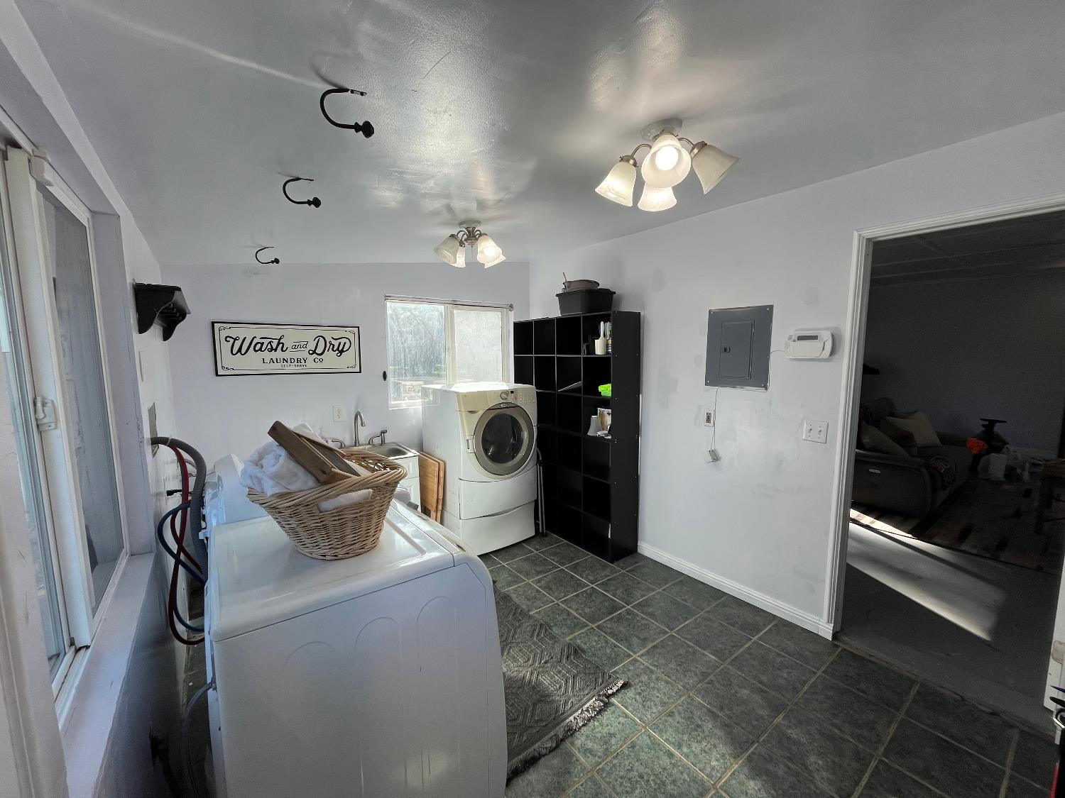 6261 Grizzly Flat Road Somerset, CA 95684 - Photo 63 of 63 a living room with furniture and a flat screen tv