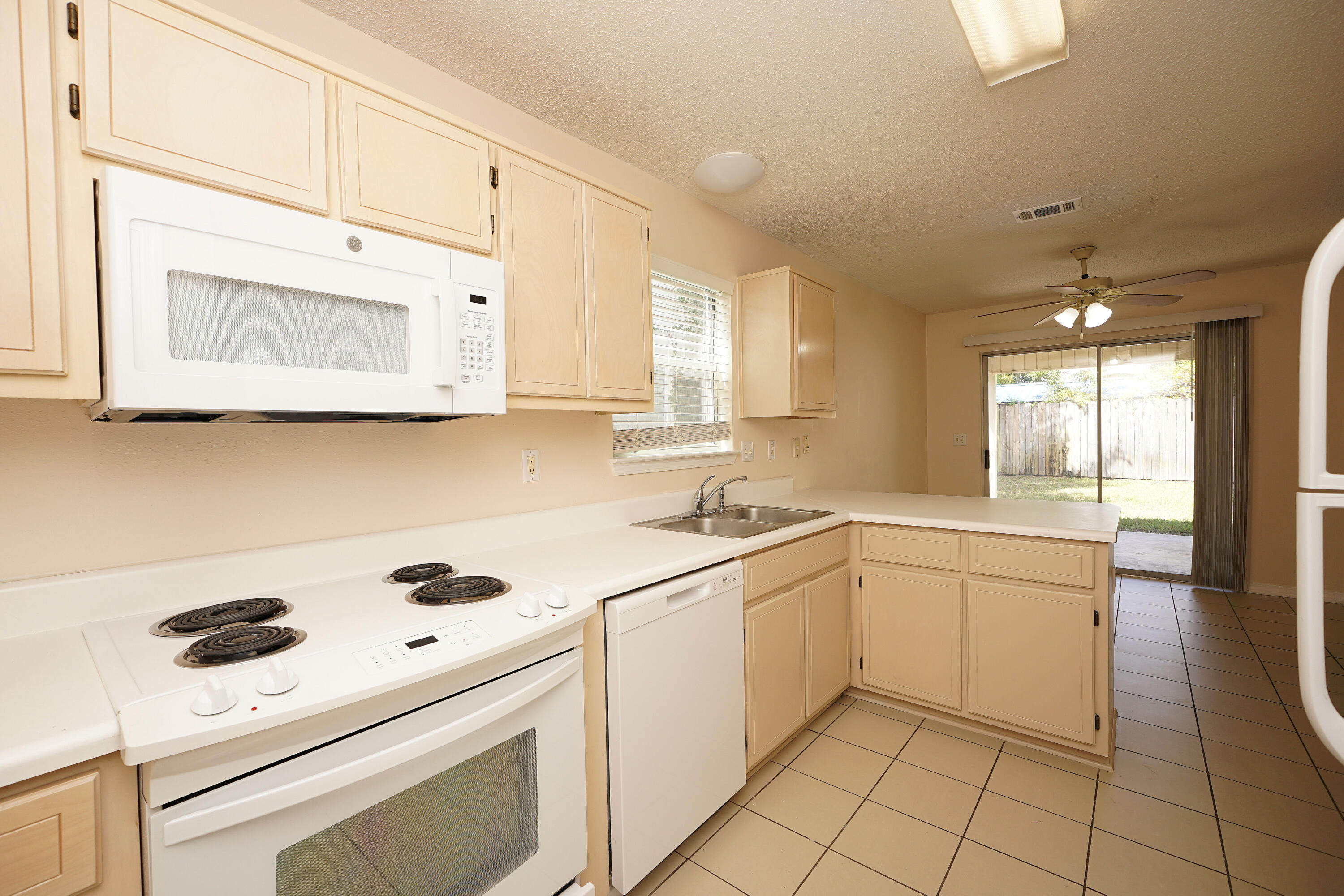 406 Springate Court Mary Esther, FL 32569 - Photo 15 of 41 a kitchen with a sink a stove and cabinets