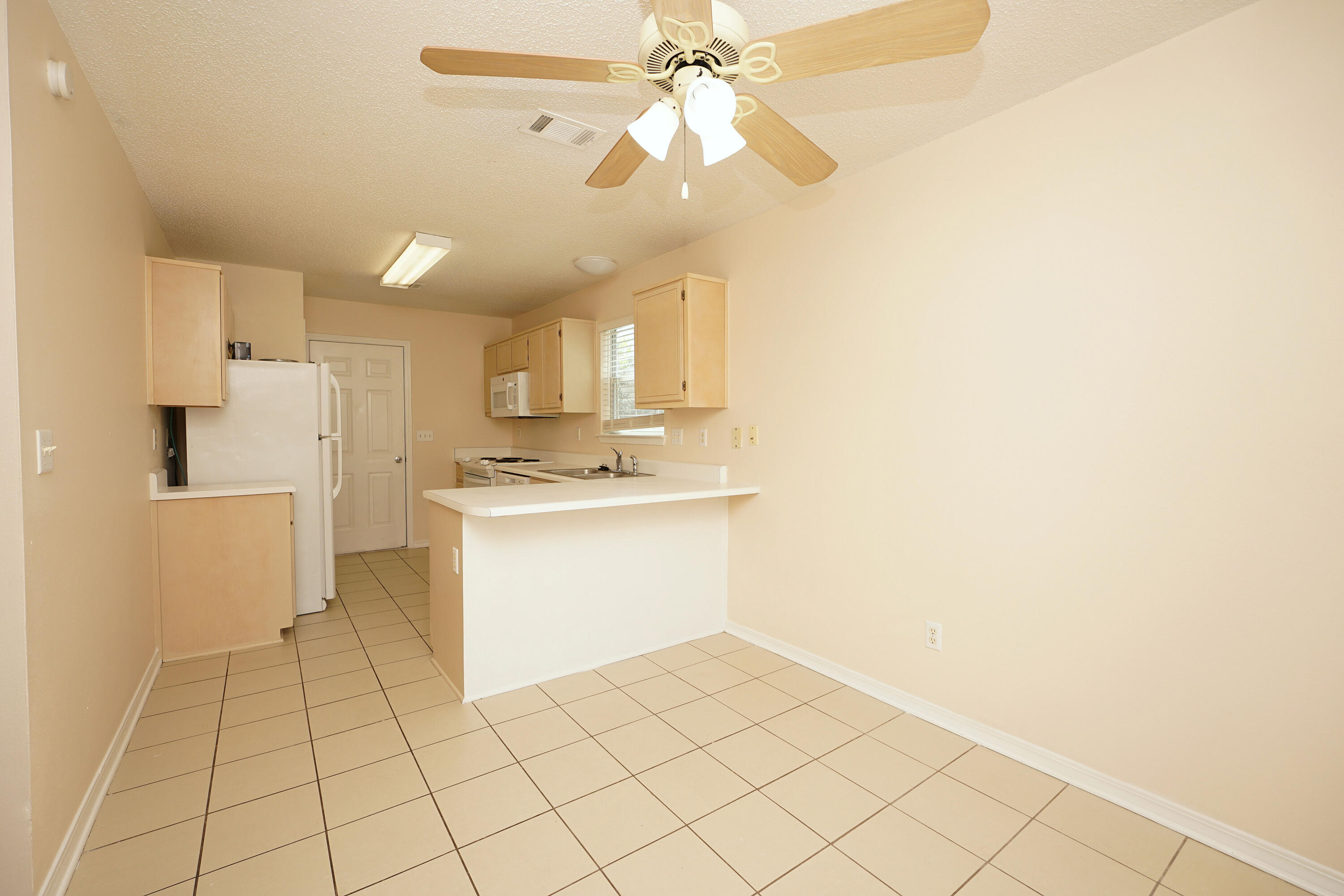 406 Springate Court Mary Esther, FL 32569 - Photo 20 of 41 a kitchen with a sink cabinets and appliances