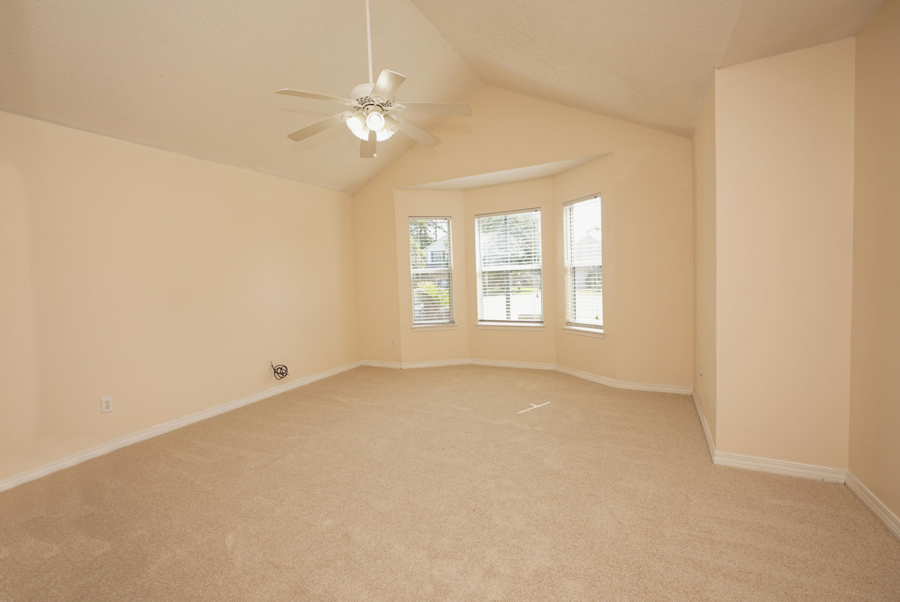 406 Springate Court Mary Esther, FL 32569 - Photo 26 of 41 an empty room with windows and chandelier fan
