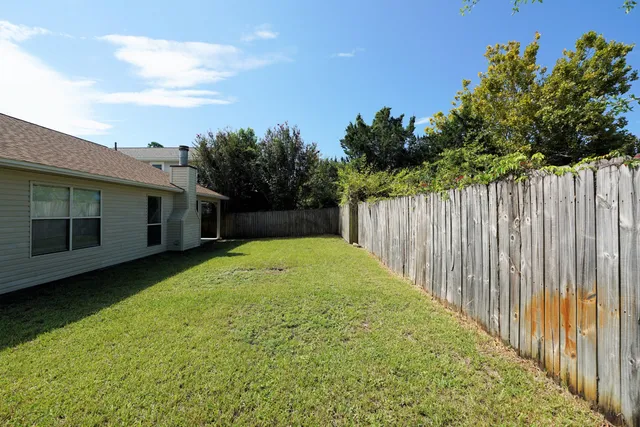 a view of a backyard with green space