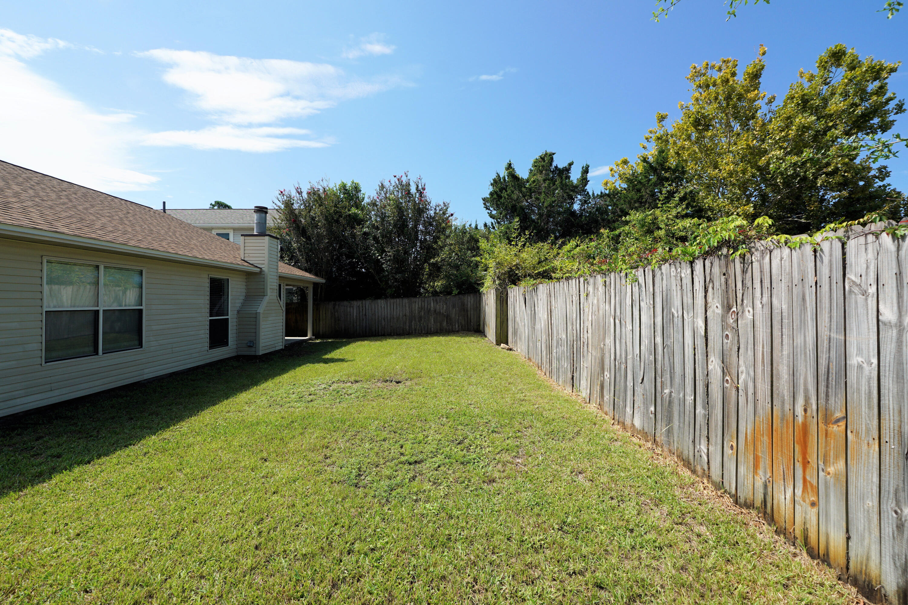 406 Springate Court Mary Esther, FL 32569 - Photo 37 of 41 a view of a backyard with green space