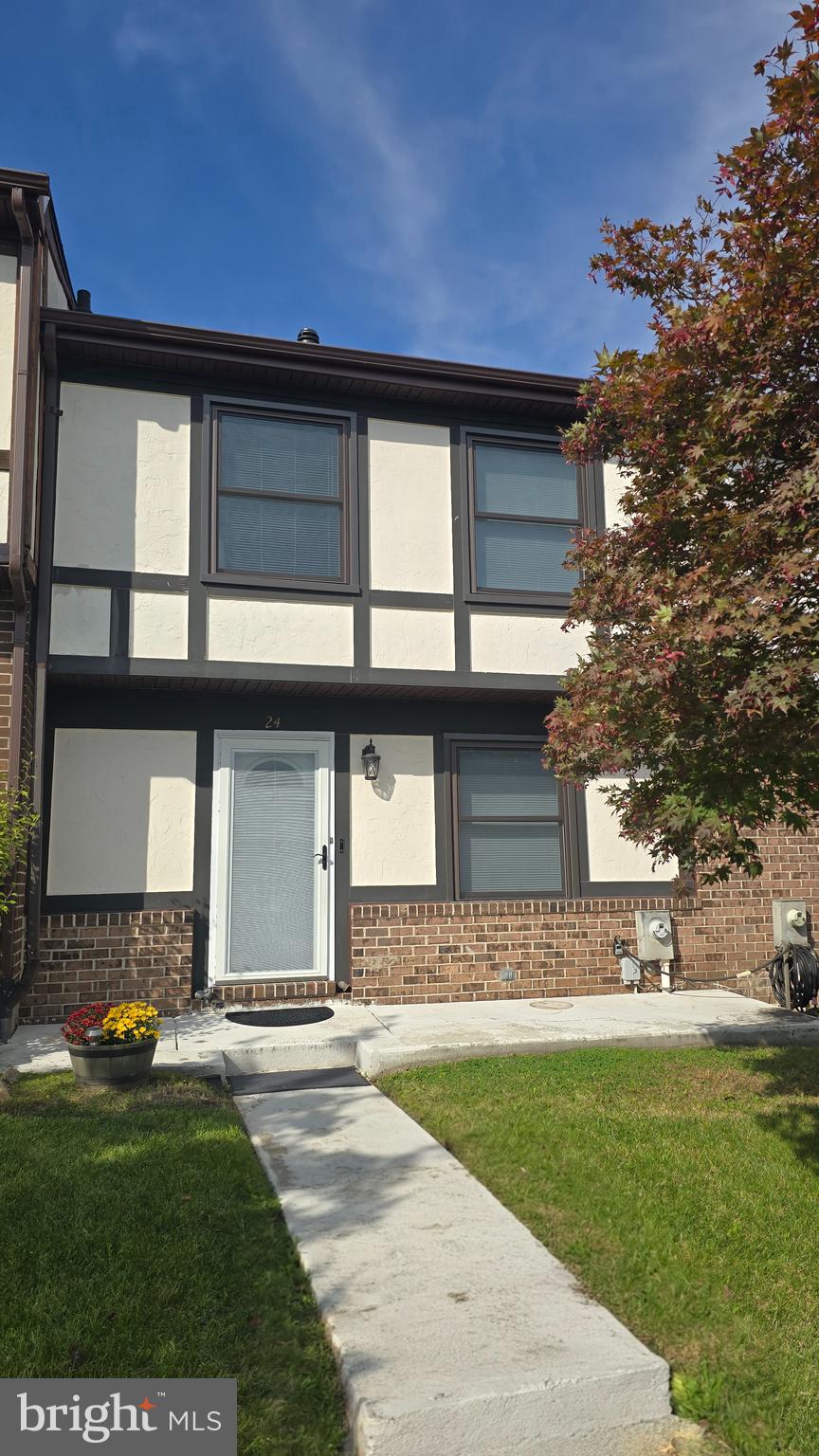 a house view with a garden space