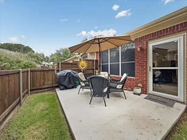 a view of a backyard with sitting area and furniture