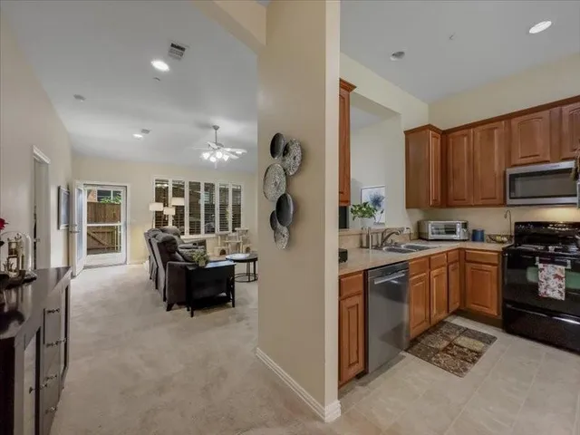a kitchen with refrigerator cabinets and furniture