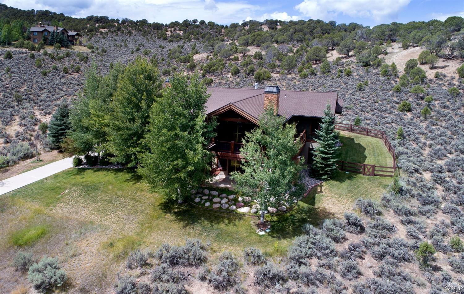 a aerial view of a house with a yard