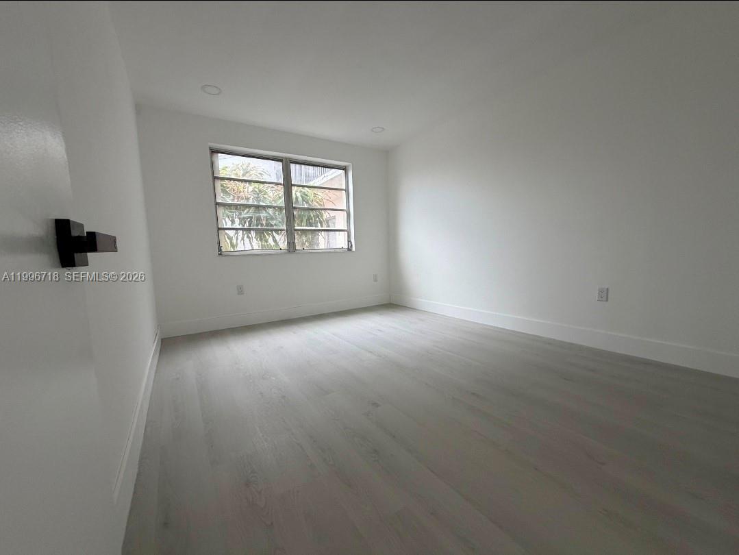 300 West 74th Place, Unit 217 Hialeah, FL 33014 - Photo 2 of 8 an empty room with windows