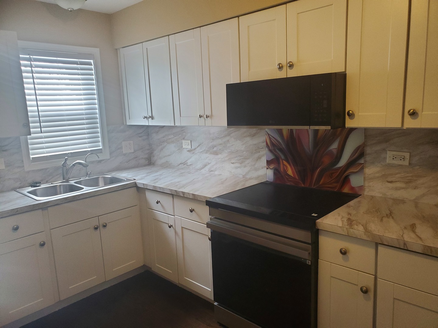 2422 12th Avenue Broadview, IL 60155 - Photo 14 of 34 a kitchen with granite countertop white cabinets and sink