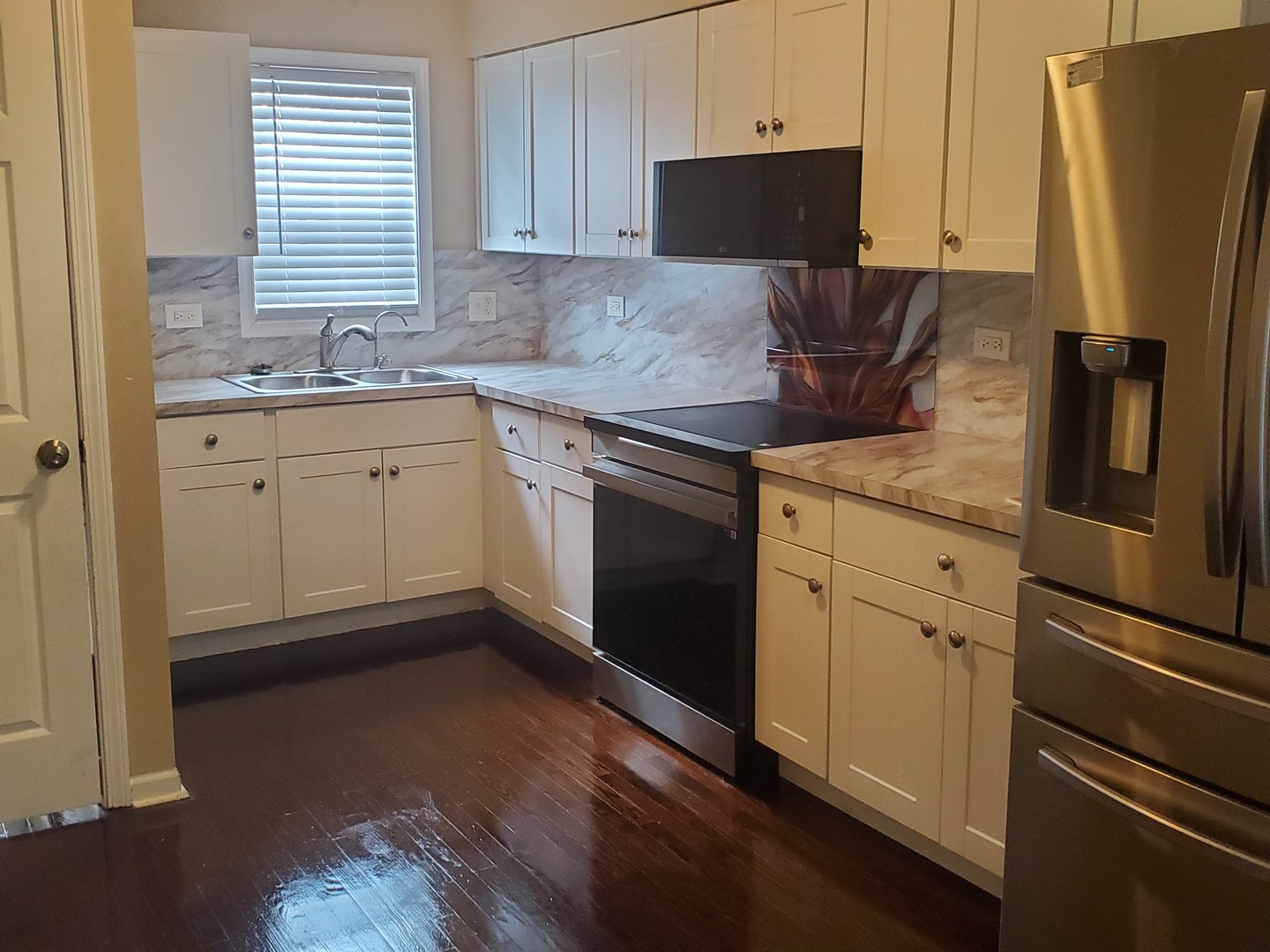 2422 12th Avenue Broadview, IL 60155 - Photo 17 of 34 a kitchen with stainless steel appliances granite countertop a refrigerator sink and stove