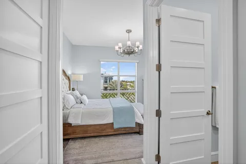 a bedroom with a bed dresser and a window