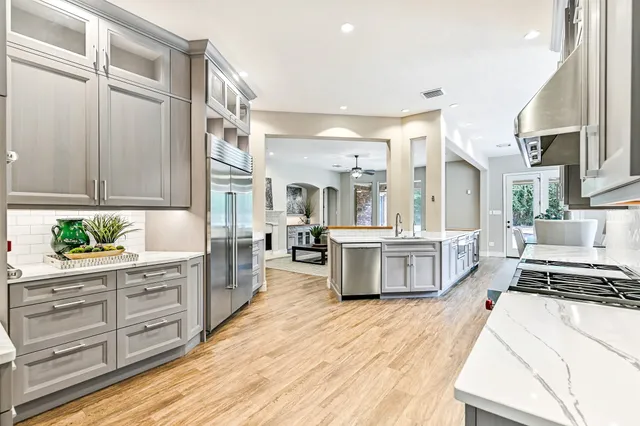 a spacious bedroom with a bed and a large window