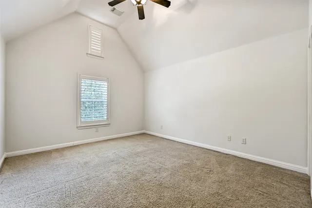a view of a porch with a floor to ceiling windows and yard