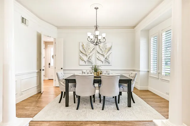 a living room with furniture fireplace and a chandelier