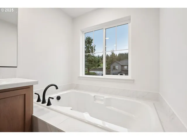 a bath tub sitting next to a window